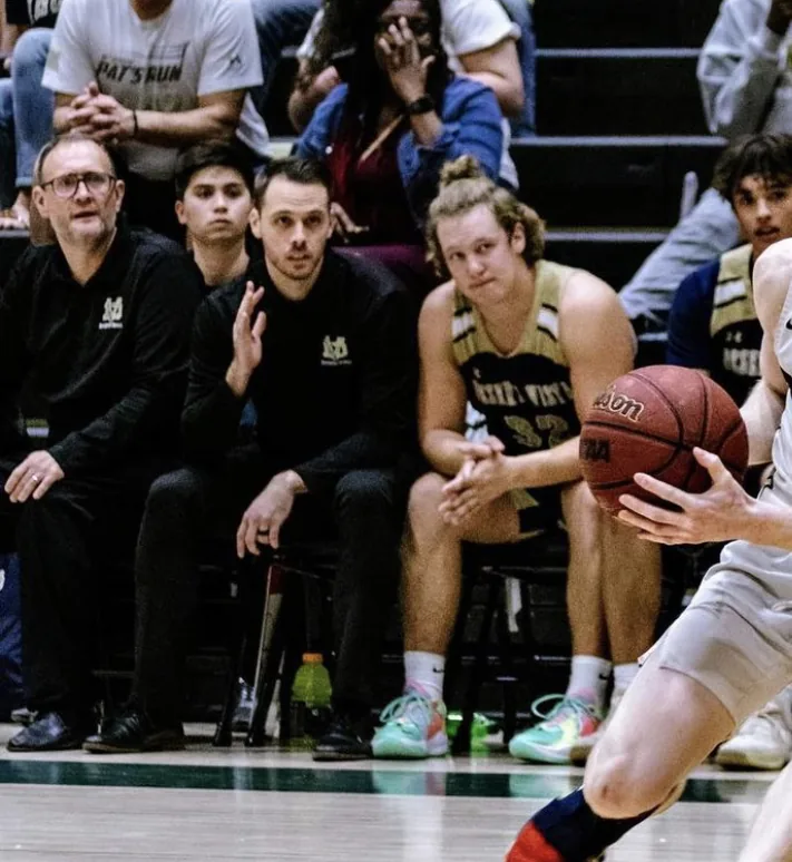 Coach Hood courtside during game coaching